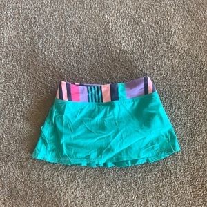 green ivivva skort with ruffles on back